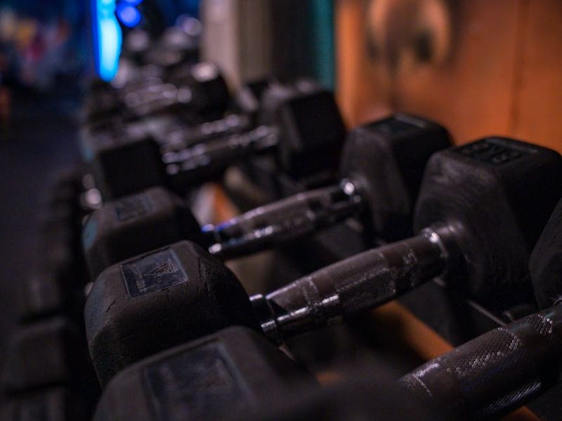 Atmospheric low light gym interior with professional equipment.